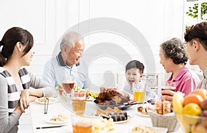 asian family having dinnerÂ at home